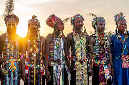 Sunset on Gerewol Sudosukai - Wodaabe people celebrating the Gerewol festival at sunset Buy Now