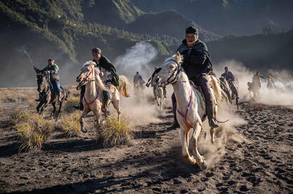 The Ride A group of Tengger horsemen riding at the foot of the Bromo volcano Buy Now