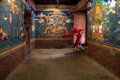 Run into the Light Young Buddhist monk entering a Dzong © Roberto Pazzi