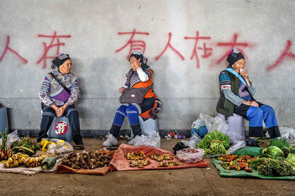 At the Market Yi women selling vegetables at the market © Roberto Pazzi