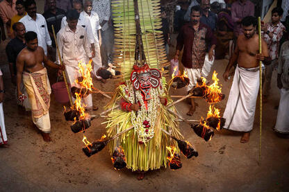 Fire and Faith A moment of the Theyyam, Hindu Shamanic ritualistic dance form © Roberto Pazzi