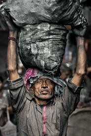 Burden of Life Portrait of a stevedor unloading coal © Roberto Pazzi