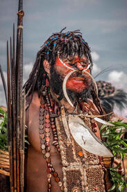Colors of War Portrait of a Dani warrior in the traditional war attire © Roberto Pazzi