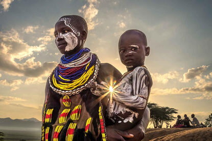 The Family of the Sun Portrait of a Kara woman with her baby © Roberto Pazzi
