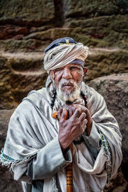 Clinging to Faith Portrait of an Orthodox priest in one of the eleven rock-hewn monolithic churches in Lalibela © Roberto Pazzi
