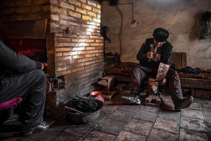 The Blacksmith Portrait of an elderly blacksmith working in his workshop © Roberto Pazzi